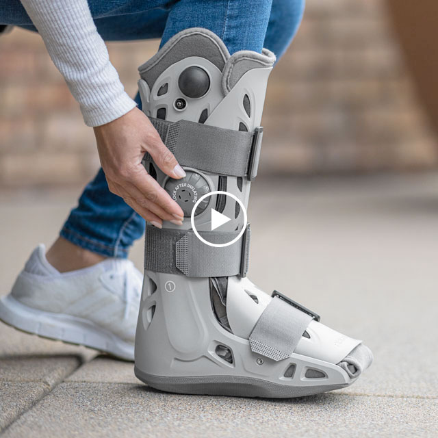 Aircast walking boot on person